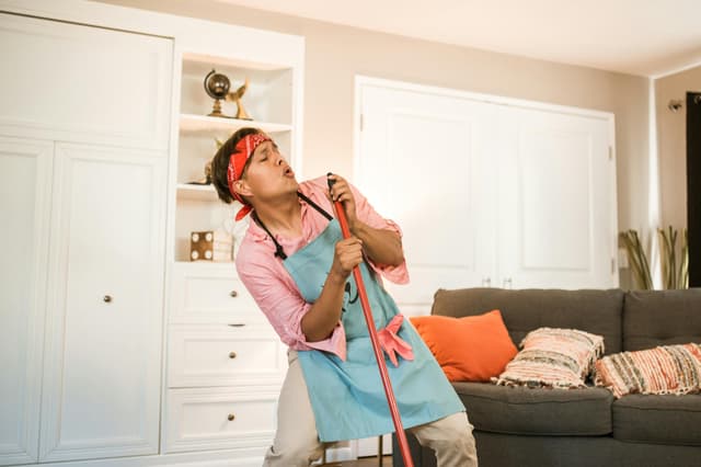 Person dancing with a mop