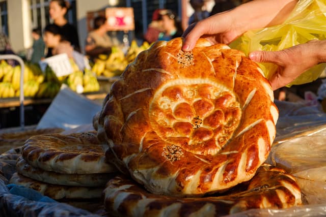 Holding traditional Uzbek bread